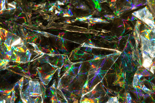 Holographic Crumpled Gold Bronze Paper Material which is Shiny for Background