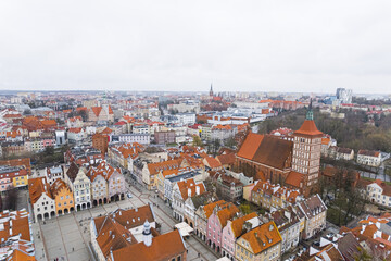 Naklejka na ściany i meble aerial cityscape of Olsztyn (Poland) old town on a cloudy day, tiny colorful buildings in the center. High quality photo