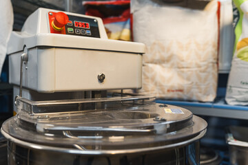 shot of an electric dough mixer machine with the measuring scale in the kitchen. High quality photo
