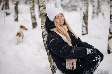 Portrait of a teenage girl in winter in the woods.
