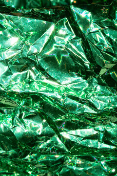 Holographic Crumpled  Green Paper Material which is Shiny for Background