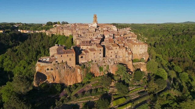 Medieval stone town on cliff - Pitigliano, Tuscany, Italy. Aerial shot of Pitigliano before sunset