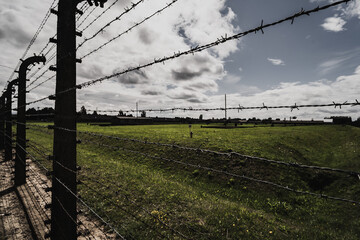 A fence with high voltage barbed wire at the Auschwitz Birkenau 2 death concentration camp.