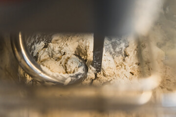 closeup shot of making process by using flour mixing machine in the factory. High quality photo