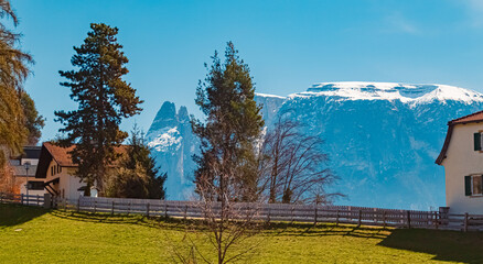Alpine spring view with Mount Schlern, dolomites, in the background seen from Klobenstein, Ritten, Eisacktal valley, South Tyrol, Italy