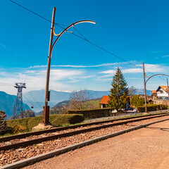 High resolution stitched alpine spring panorama with railroad tracks near Oberbozen, Ritten,...
