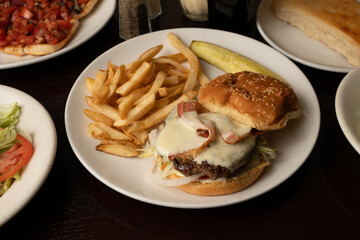 Cheeseburger with bacon and French fries
