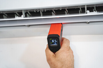 Technicians check temperature service repair and maintenance of air conditioners