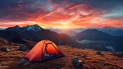 camping tent high in the mountains at sunset.