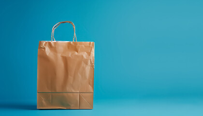 A brown paper bag is sitting on a blue background