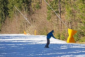 snowboarder goes down the slope. safe active recreation