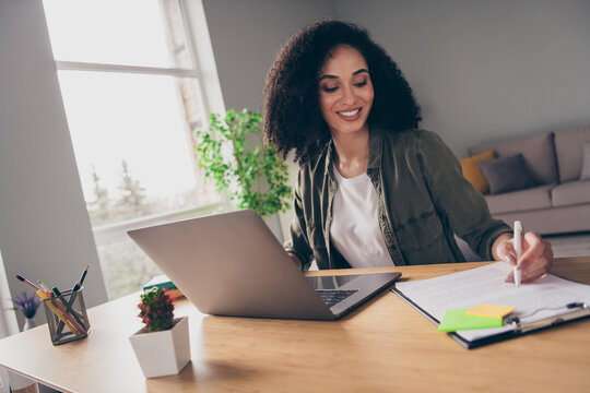 Photo of pretty smiling lady lawyer dressed shirt signing documents modern gadget indoors workshop workplace workstation