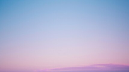 The serene skyline is painted with soft purples and pinks, as dusk brings a quiet end to the day.