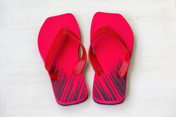 A pair of red flip-flops sandals 