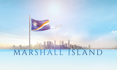 Marshall Islands national flag waving in beautiful building skyline.