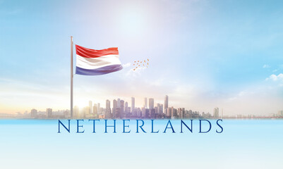 Netherlands national flag waving in beautiful building skyline.