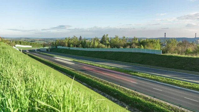 Early morning traffic on Walbrzych bypass next to  Piaskowa g&oacute;ra a district of a city in Poland with post-communist High-rises 