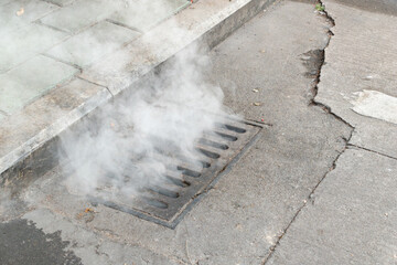 smokes coming out from sewer
