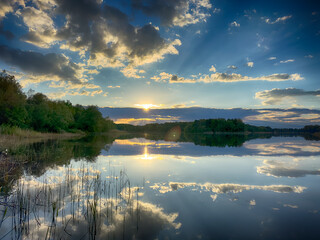 Serene Fishing Lake: A peaceful scene by the tranquil waters of a secluded fishing lake
