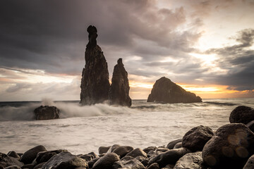 Ribeira da Janela. Volcanic  rock formations standing the Atlantic Ocean at dramatic sunrise,...