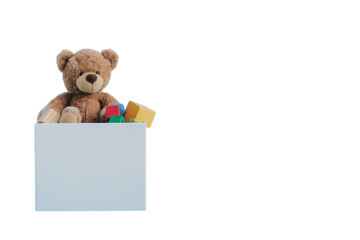 1️⃣ A teddy bear toy box with children's toys on a white background, a high resolution photographic stock photo with copy space on the left side of the frame for text, in the style of unknown artist