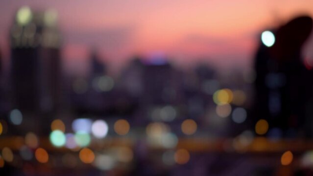 Blurred of city skyscraper and tower lights bokeh in sunset sky , Soft Focus , Metropolis Backgound wallpaper for movie or documentary romantic mood concept	
