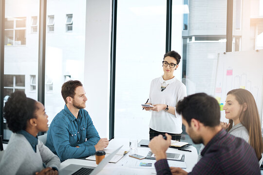 Woman, mentor and training in meeting with presentation for feedback, info and development of team. Business, workshop and manager coaching group with idea to progress productivity and increase sales