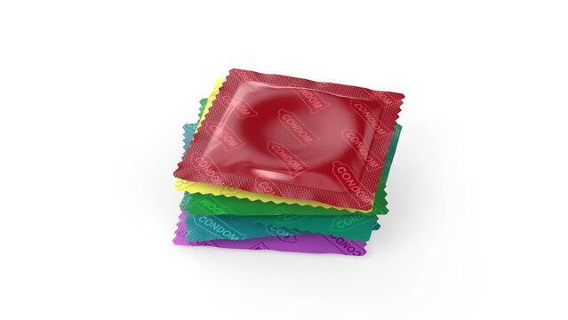 Stack of six different condoms on white background
