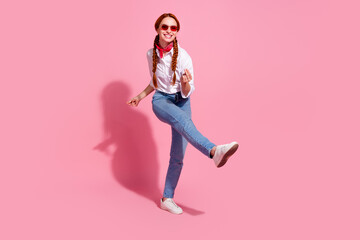 Full length photo of cheerful funky lady dressed cowboy outfit dark red eyewear having fun isolated pink color background