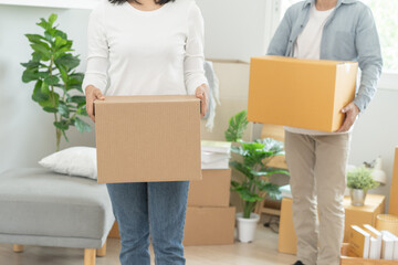 People relocation move home concept, Man carrying belongings box moving in new apartment.