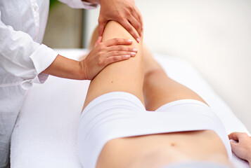 Woman, spa and leg massage for wellbeing, health and physical therapy for wellness break. Lady,...