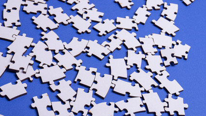 white deconstructed puzzles on a colored background