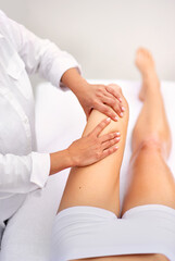 Woman, spa and leg massage for treatment, health and physical therapy for wellbeing break. Lady, detox and muscle wellness for body care, stress relief and zen for peaceful beauty or skincare