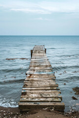 Fototapeta premium Old abandoned pier at the sea, minimalist photography