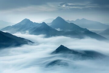 serene mountain peaks emerging through a veil of fog captivating landscape evoking tranquility and mystery