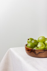 Gooseberry in a wooden bowl