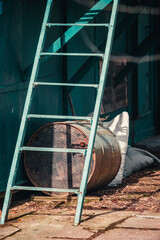 garden barrel under the iron stairs, green poor house