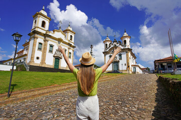 Tourism in Minas Gerais, Brazil. Traveler girl visiting historical town of Mariana with baroque colonial architecture, Brazil.