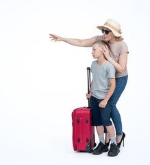Family, mom in sunglasses and hat with a red suitcase, shows her son the purpose of the trip, isolated on a light blue background