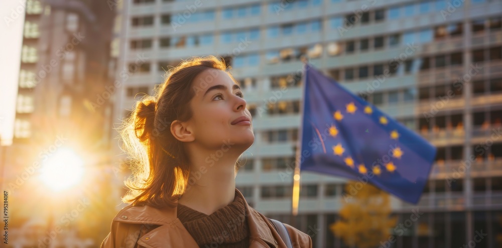 Wall mural young woman holds european flag in her hands - Wall murals