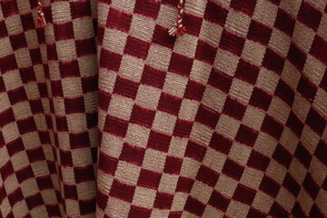 
Handwoven blanket with white and red checkered design. Traditional Argentine gaucho woven poncho....