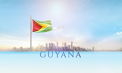 Guyana national flag waving in beautiful building skyline.