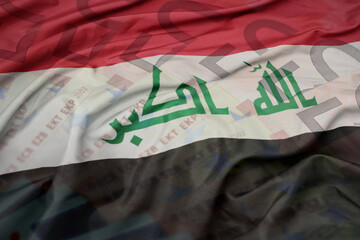 waving colorful national flag of iraq on a euro money banknotes background. finance concept.