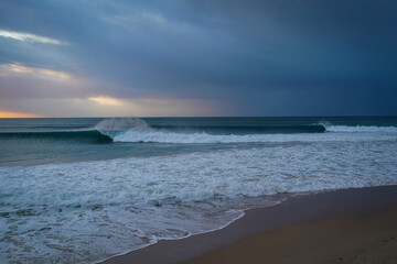 Fototapeta na wymiar Dawn arrives with perfect surf - Jeffreys Bay, Cape Town
