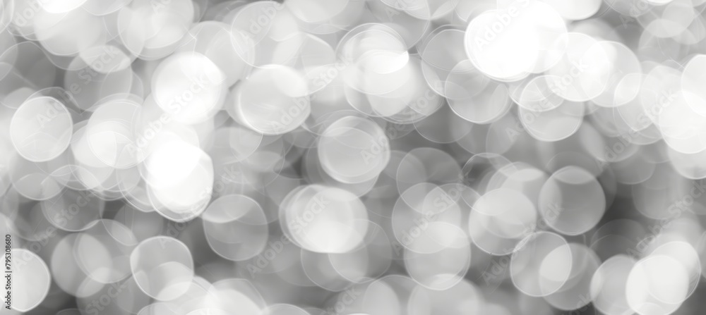 Poster abstract grey light bokeh background with blurred defocused effect for artistic design