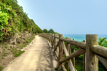 path with wooden fencing along the Atlantic Ocean, Northern Route Basque Country.