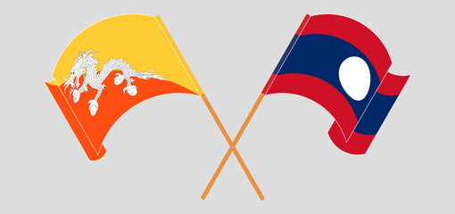 Crossed and waving flags of Bhutan and Laos