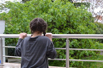 child looking out the window