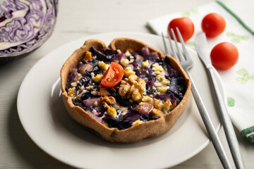 French quiche with red cabbage and vegetables. Traditional French recipe.