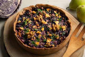 French quiche with red cabbage and vegetables. Traditional French recipe.